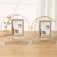 Cadre photo en cercle de fer en gros, base en bois avec feuilles noires, décoration bohème pour la maison, MOQ flexible, directement de l'usine