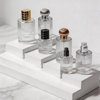 Vente en gros de flacons de parfum transparents à rayures verticales 10ml 30ml 40ml, design luxueux de haute qualité, flacon en verre avec vaporisateur, crème pour la peau, mascara