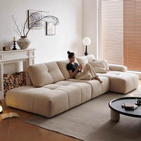 Canapé d'angle en L moderne et luxueux avec assise large et dossier réglable, en tissu, design actuel pour villa et maison