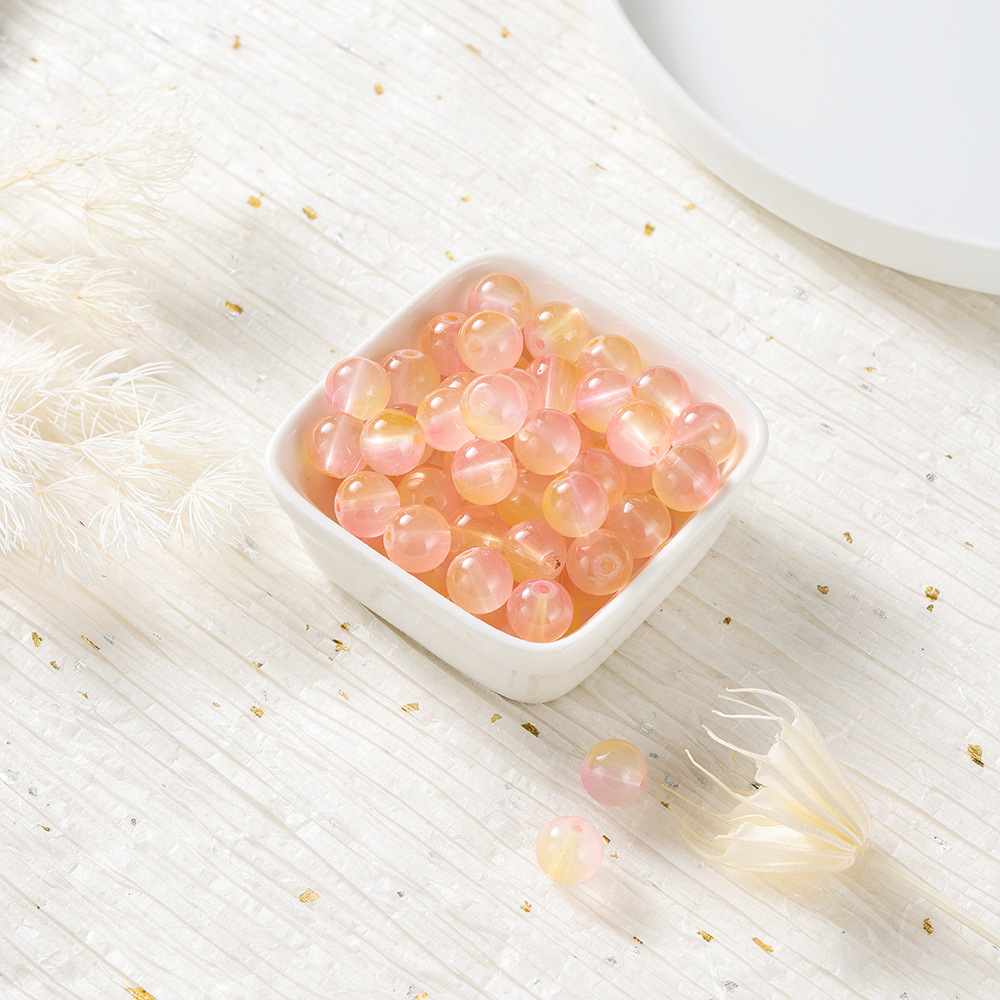 Perles de verre bicolores - orange et rose