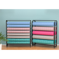 Présentoir à roulettes double face pour rouleaux de tissu, tapis, nappes et cuir