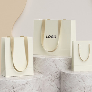 Bán buôn Quà tặng Túi giấy tùy chỉnh cao cấp in túi giấy quần áo mua sắm túi quà tặng với logo - Product Image 1