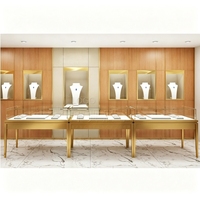 Vitrine de présentation haut de gamme pour bijoux en bois et or champagne, solution de conception complète de magasin pour partenaires Fortune 500