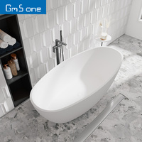 Baignoire ovale autoportante de luxe au design moderne en pierre artificielle massif, neuve, capacité 1 personne, pour hôtel, avec drain intégré