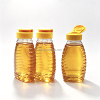 Vente en gros de bouteilles de miel en PET de 250 g avec valve anti-fuite