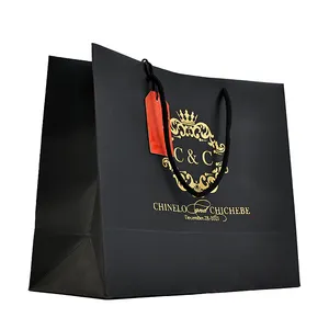 Customized Pink Cardboard Shopping Shoes And Clothing Luxury Gold Foil Paper Bags With Ribbon Handle