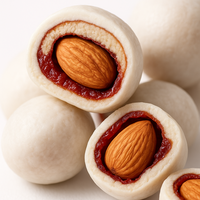 Dattes rouges fourrées aux amandes de marque privée, enrobées d'un glaçage crémeux au lait, collations saines aux noix