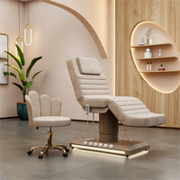 Lit de soin électrique moderne avec base dorée, éclairage LED et télécommande pour salon de beauté et massage