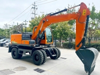 Excavatrice hydraulique sur roues fiable DX150W pour la construction de ponts, l'installation de pipelines, la maintenance routière et les projets d'infrastructure