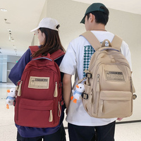 Sac à dos de voyage classique, durable, imperméable, couleur unie, grande capacité, sac à dos personnalisé pour le lycée