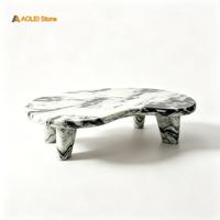 Table basse moderne artistique en marbre noir et blanc en forme de rein, idéale pour la décoration de salon de luxe.