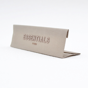 <strong>Custom</strong> Garment Rubber Embossed Logo On Woven <strong>Label</strong> Iron On 3D Silicone Printing Rubber <strong>Labels</strong> For <strong>Clothing</strong>