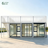 Maison préfabriquée australienne à toit plat, pliable, portable et extensible, avec murs-rideaux en verre et balcons