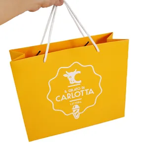 Оптовая продажа, роскошный желтый многоразовый бумажный пакет с логотипом на заказ, упаковка для пищевых продуктов, бумажные подарочные пакеты с ручками