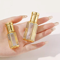 Bouteille d'huile de parfum essentielle en verre vide de luxe de Dubaï de 3ml 6ml 12ml avec Roll-on Golden Pattern UV Graver Arabian Attar Bottles