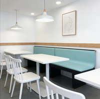 Canapé élégant de style moderne, chaises et table en pierre frittée, cadre en métal et cuir sur mesure, vente en gros pour restaurant