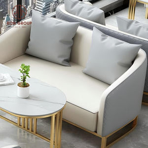 Ensemble de meubles de salle à manger moderne, table ronde en marbre avec base creuse dorée et quatre fauteuils gris pour café - Product Image 4