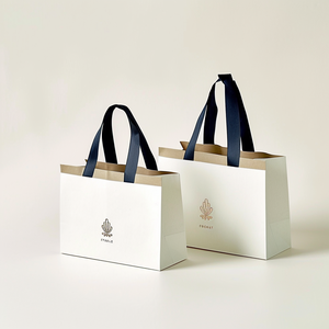 Custom Luxury <b>White</b> <b>Paper</b> Shopping <b>Bags</b> Personalized Logo Gift Packaging Tote <b>Bag</b> OEM Wholesale Supplier - Product Image 1