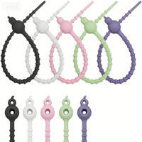 Attache-câble en silicone double trou en forme de gourde, réutilisable, multifonctionnel et coloré pour le regroupement de câbles (vente en gros)