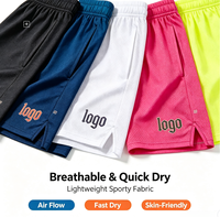 Shorts de basketball personnalisés pour hommes en maille respirante Spandex/Polyester avec logo imprimé par transfert thermique sur le devant et cordon de serrage OEM/ODM