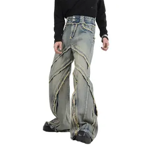 Custom deconstructed raw edge paneled bootcut jeans wholesale manufacturer bleach washed flare denim pants for men