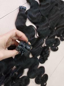 Extensiones de cabello virgen vietnamita de onda de cuerpo negro Natural de alta calidad cinta sin procesar con hermosa cutícula - Product Image 6