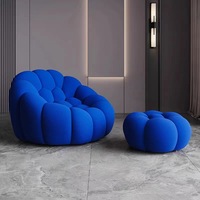 Fauteuil individuel de relaxation Roche Bobois Bubble Comfort, design moderne et luxueux, avec accoudoirs rouges, pour salon