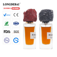Nouvelle conception de flacon de parfum carré haut de gamme en verre, 30 ml, 50 ml, 100 ml, flacon de parfum de niche transparent avec bouchon en pierre colorée