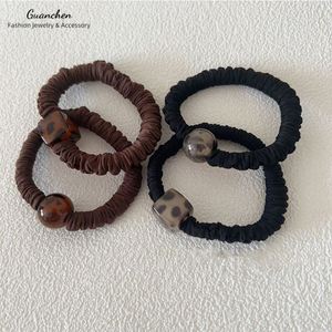 Coleteros de Tela Delgados y Duraderos en Negro y Marrón para Niñas, con Estampado de Leopardo, Bandas Elásticas para el Cabello - Product Image 1