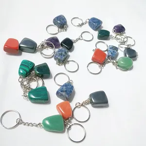 Gran oferta de fábrica DIY, venta al por mayor, Colgante de Piedra dorada azul, jaula de piedra de sangre, llavero caído, cristales grabados con láser