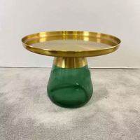 Table basse en verre vert avec plateau en métal