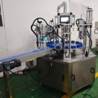Machine de remplissage automatique rotative pour parfums, machine de remplissage sous vide et de sertissage de colliers pour la production de fragrances