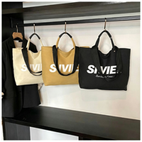 Sac fourre-tout en toile uni grande capacité réutilisable, sac de shopping à bandoulière, personnalisable avec logo et couleur pour usage quotidien, OEM ODM