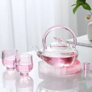 Transparent pink butterfly tea brewing home tea pot