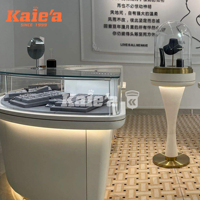 Rak Pajangan Perhiasan Kaca Lengkung Mewah dengan Lampu LED Khusus untuk Toko Ritel Cincin dan Kalung Kelas Atas