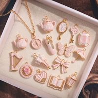 Ciondolo Vintage in Stile Femminile con Fiocco, Libro e Farfalla in Acciaio Inox Placcato Oro con Pizzo Rosa Francese, Accessori per Gioielli Fai-da-Te