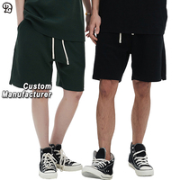 Shorts décontractés pour hommes, coupe ample, style streetwear, avec cordon de serrage, taille élastique, respirants, en tissu gaufré, mi-cuisse, pour l'été