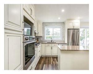 Moderno Gabinete Cocina American RTA Set Pared de madera maciza Textura de roble Diseño de almacenamiento minimalista Gabinete de cocina - Product Image 6