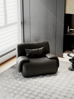 Fauteuil individuel haut de gamme de style italien pour salon, pièce design artistique, siège premium noir en cuir véritable, structure métallique, pour bureau