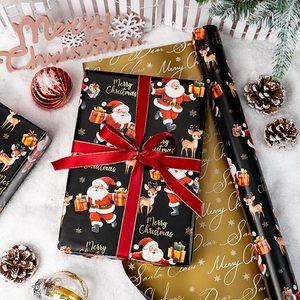 Papier cadeau de Noël noir et or, double face, motif mignon Père Noël et rennes - Product Image 1