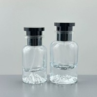 Flacon de parfum de luxe en verre transparent avec base en forme de montagne, capuchon pulvérisateur noir, flacon de parfum rechargeable