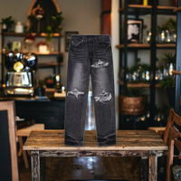 Jeans Slim Homme AMI RI Rock n Roll en Denim avec Effet Usé de Luxe, Coupe Empilée et Patchs Signature