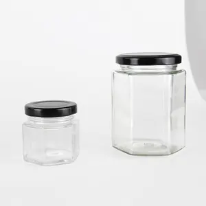 Venda quente vidro jar mel jar comida pequeno frasco embalagem recipiente hexagonal com tampa do parafuso do metal