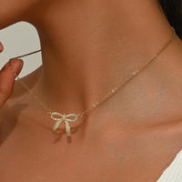 Collier pour femme en alliage de bambou plaqué or avec nœud papillon et strass, style européen/américain, simple et tendance, vente en gros
