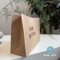 Sacs en papier kraft avec poignées, sacs de courses écologiques et sacs d'emballage pour vêtements avec logo personnalisé disponible