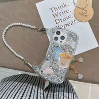 Coque de téléphone de luxe antichoc pour femme avec dragonne diamantée, strass, papillon, perle et fleur pour iPhone 13/14/15/16/17