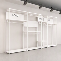 Présentoir de vêtements en métal noir avec logo personnalisé pour magasin de vêtements pour hommes, support de présentation de costumes pour hommes, présentoir de vêtements de vente au détail