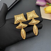 Boucles d'oreilles vintage à clip en laiton à motif géométrique queue de poisson avec placage or 18 carats