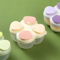 Boîte de distribution de lait en poudre pour bébé portable en PP à quatre compartiments pour les sorties des nouveau-nés