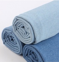 Tela vaquera elástica lavada de sarga, tela de mezclilla cruda tejida, tela lisa para pantalones, vaqueros, chaquetas, bolsos, zapatos y sombreros de estilo moderno.